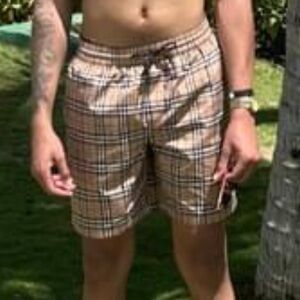 Check Burberry swim trunks